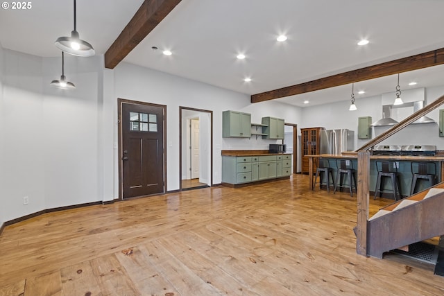 living room featuring light hardwood / wood-style floors and beam ceiling