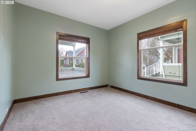 spare room featuring carpet floors