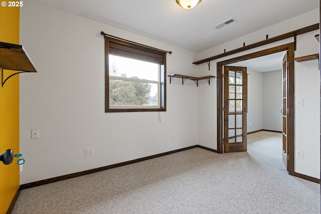 carpeted empty room with a wealth of natural light