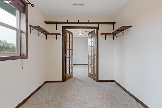 interior space featuring french doors and a healthy amount of sunlight