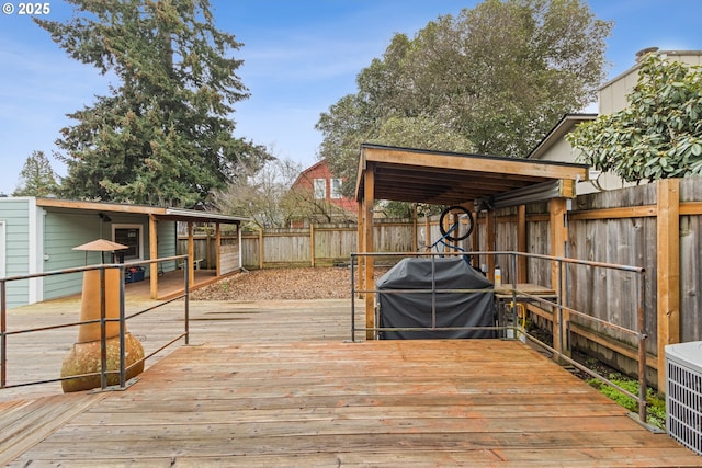 wooden terrace with grilling area and central AC