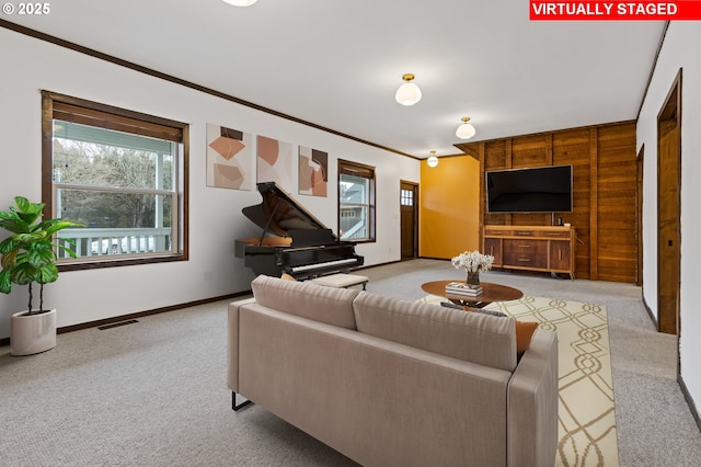 living room with light carpet and crown molding