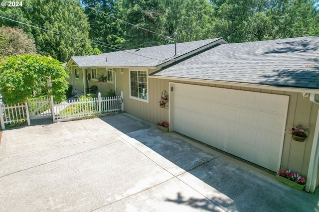 94504 Smokey Ln, Coquille, OR 97423 - single story home with fence, a shingled roof, an attached garage, and concrete driveway