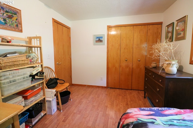 bedroom featuring a closet and light hardwood / wood-style flooring