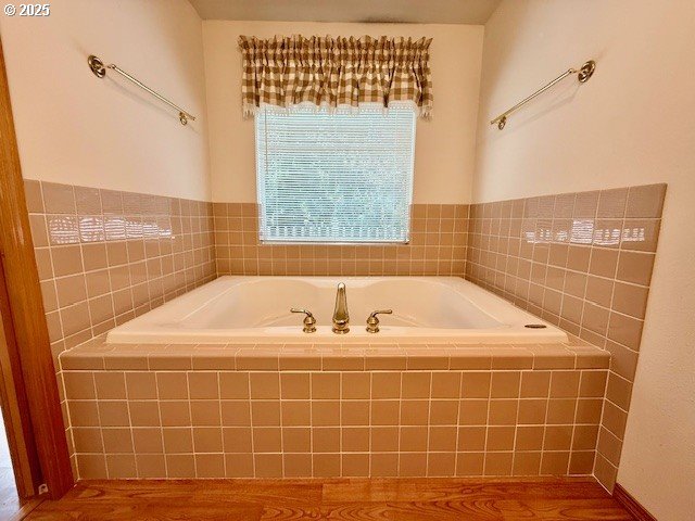 94504 Smokey Ln, Coquille, OR 97423 - bathroom with a bath and wood finished floors