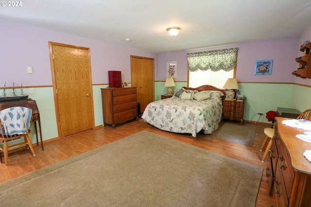 bedroom with hardwood / wood-style floors