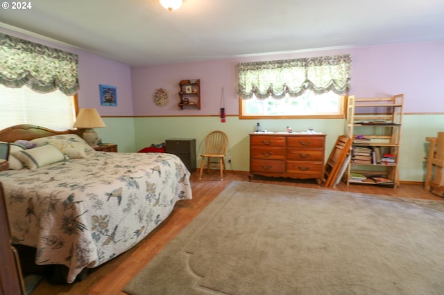 bedroom with hardwood / wood-style flooring