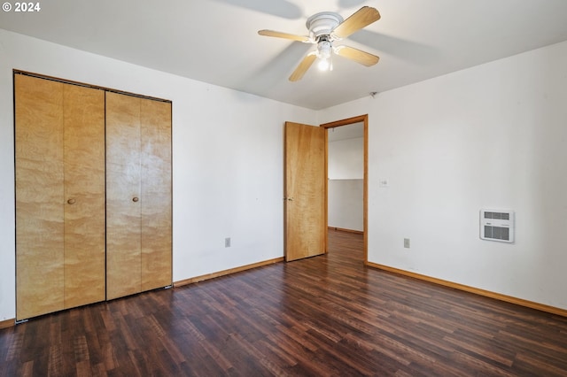 565 W Airway Rd, Lebanon, OR 97355 - unfurnished bedroom with baseboards, heating unit, and wood finished floors