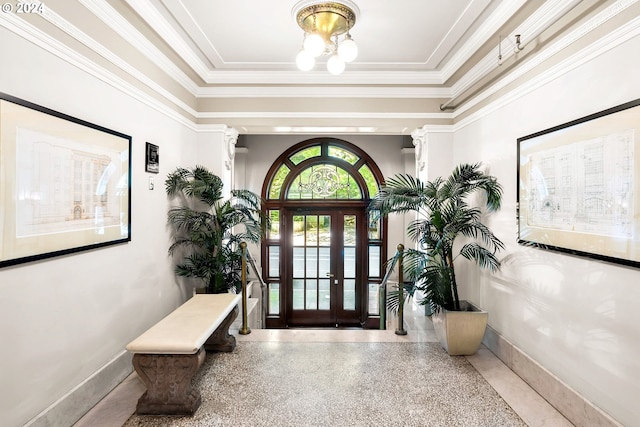 entrance foyer featuring ornamental molding and french doors