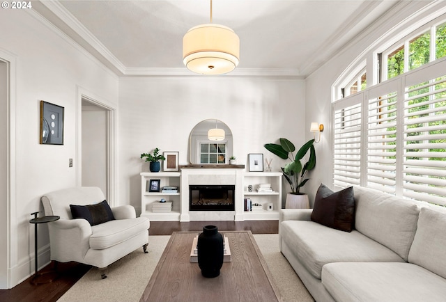 living room featuring hardwood / wood-style flooring and ornamental molding