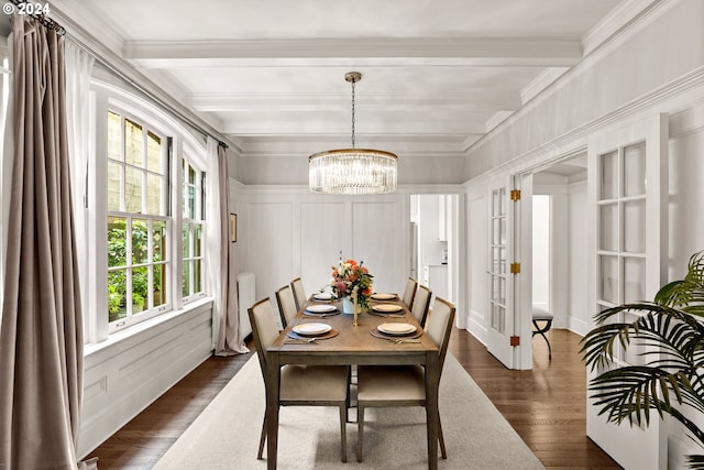 dining area with a chandelier, beam ceiling, crown molding, and dark wood-type flooring