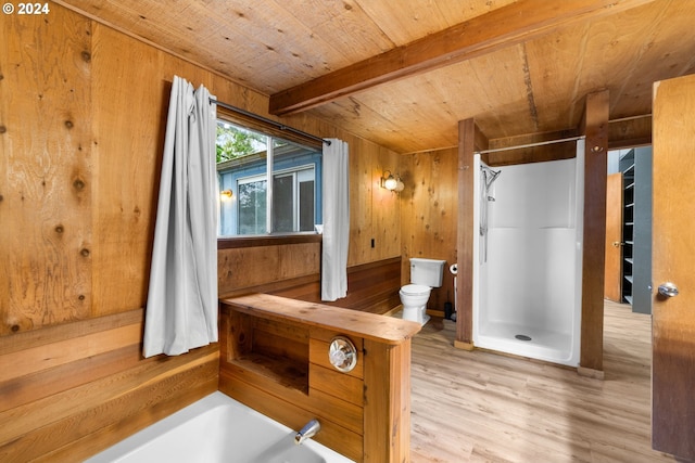 bathroom featuring beam ceiling, wooden ceiling, toilet, wooden walls, and independent shower and bath