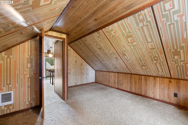 bonus room featuring heating unit, carpet, wooden ceiling, and vaulted ceiling