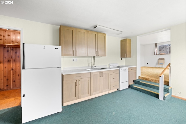 kitchen featuring dark carpet, white appliances, sink, and light brown cabinets