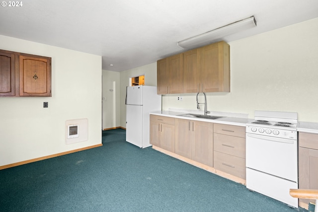 kitchen with light brown cabinets, sink, white appliances, and dark colored carpet