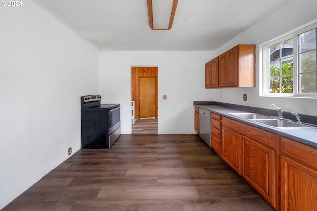 kitchen featuring appliances with stainless steel finishes, sink, and dark hardwood / wood-style floors