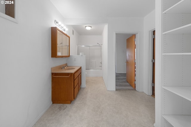 full bathroom featuring shower / bath combination with glass door, vanity, and toilet