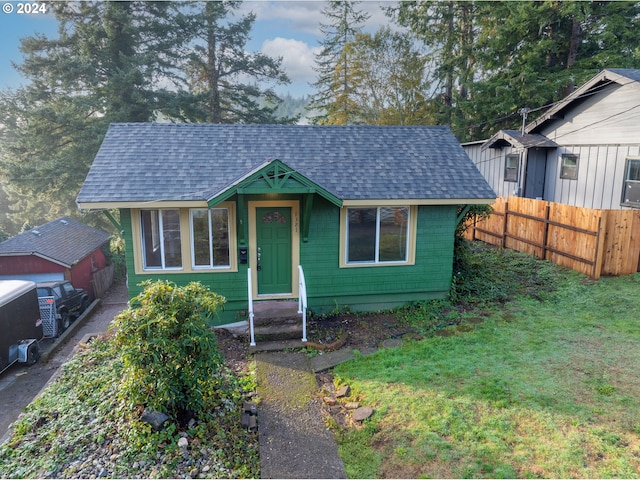 bungalow-style house with a front yard