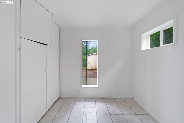 spare room with light tile patterned floors