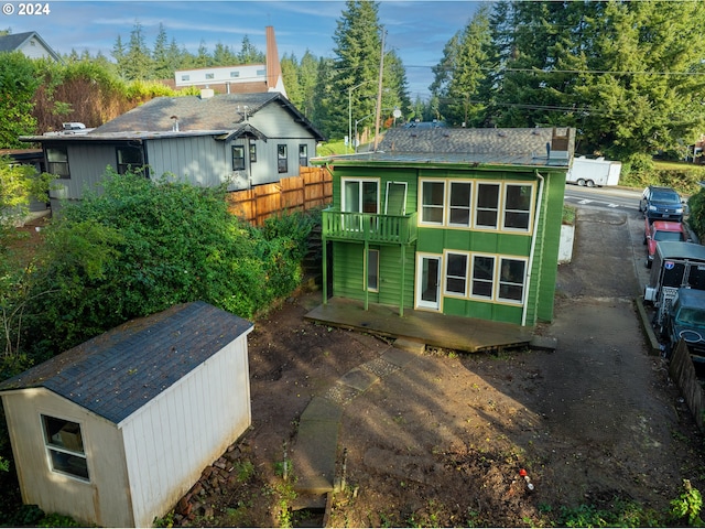 rear view of house with an outbuilding