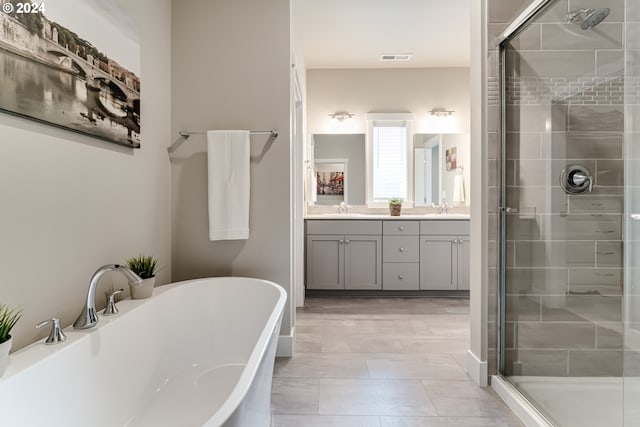 3763 Rockcress Rd, Eugene, OR 97403 - full bathroom with a stall shower, double vanity, a freestanding tub, and tile patterned floors