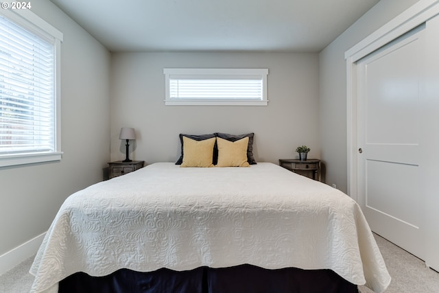 bedroom with light carpet