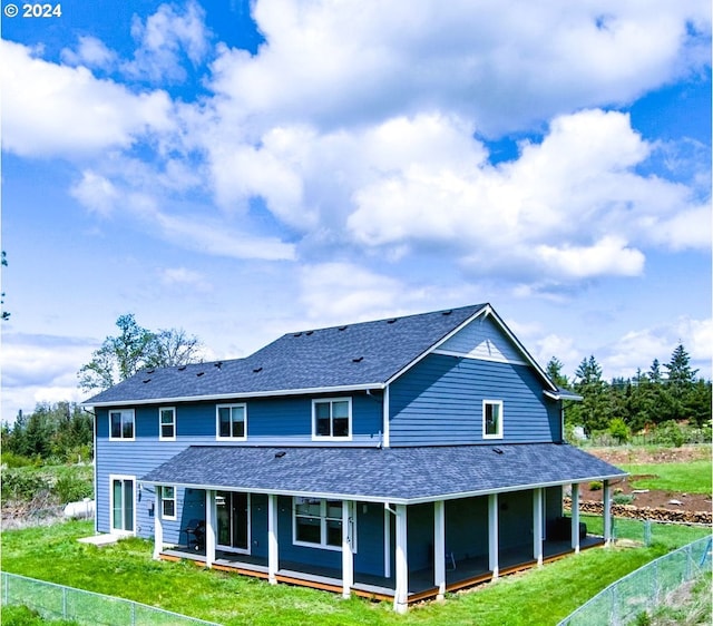 back of property with a sunroom