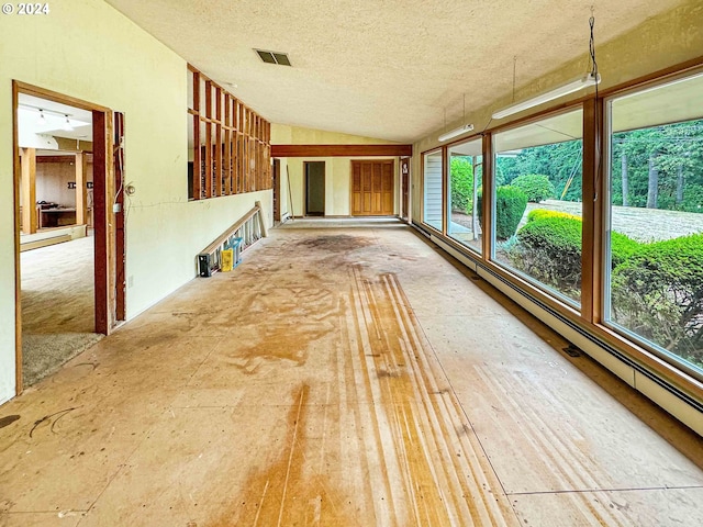 unfurnished sunroom with lofted ceiling