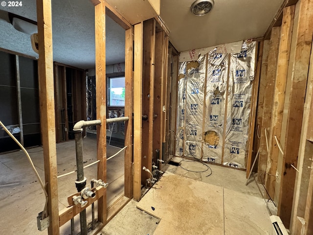 bathroom with a baseboard heating unit