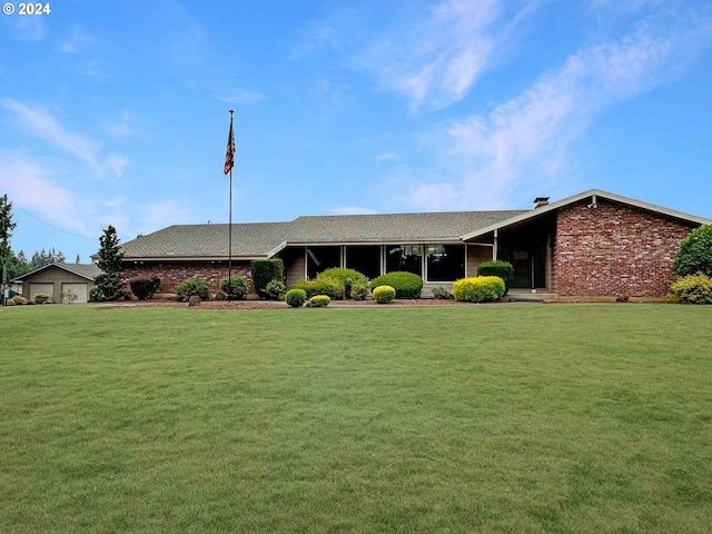 ranch-style house with a front yard