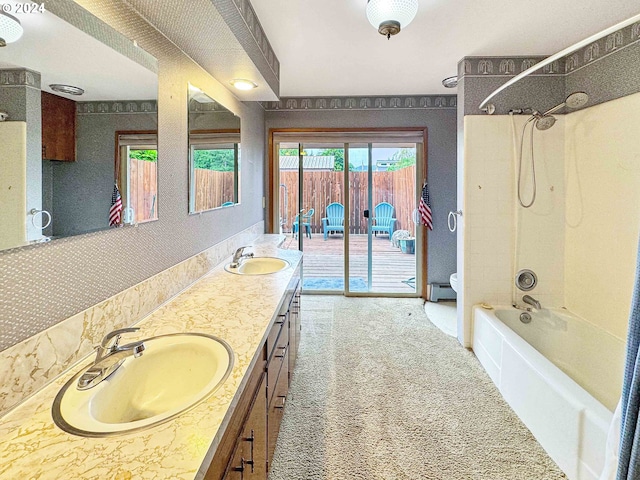 bathroom with vanity, shower / bathing tub combination, and baseboard heating