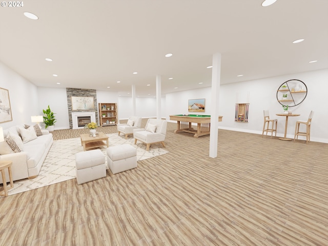 living room featuring light hardwood / wood-style floors and a fireplace