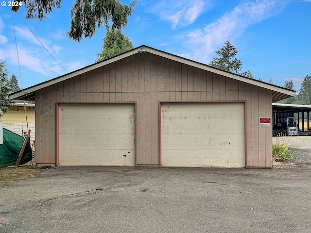 garage featuring wood walls