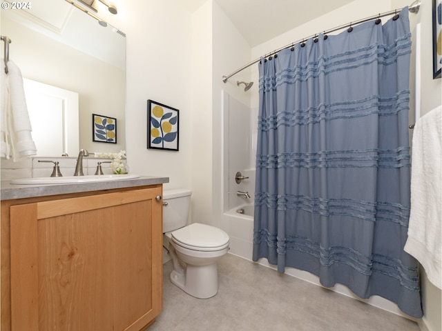 full bathroom with vanity, shower / tub combo with curtain, and toilet