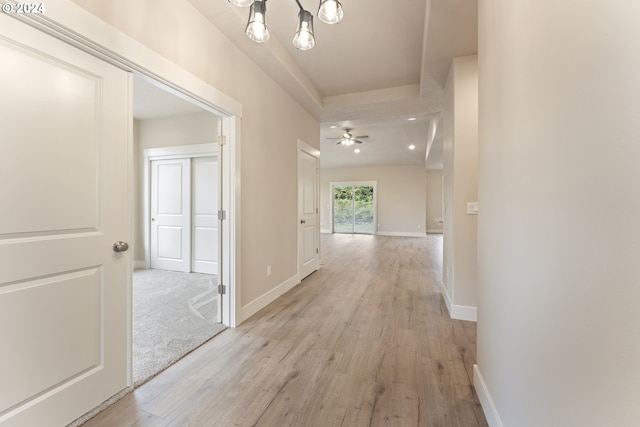 corridor with light wood-type flooring