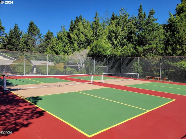 view of sport court with community basketball court and fence