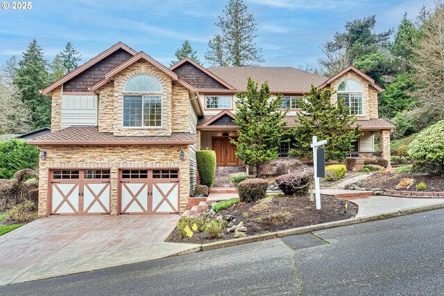 craftsman inspired home with a garage