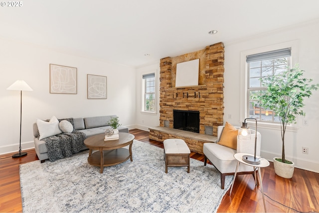6145 SW Sweetbriar Ct, Portland, OR 97221 - living area with wood finished floors, baseboards, and a fireplace