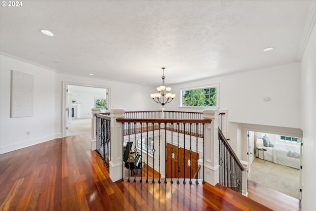 6145 SW Sweetbriar Ct, Portland, OR 97221 - hall with an upstairs landing, a chandelier, wood finished floors, recessed lighting, and baseboards