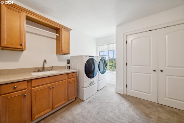 6145 SW Sweetbriar Ct, Portland, OR 97221 - clothes washing area featuring cabinet space, washer and dryer, and light colored carpet