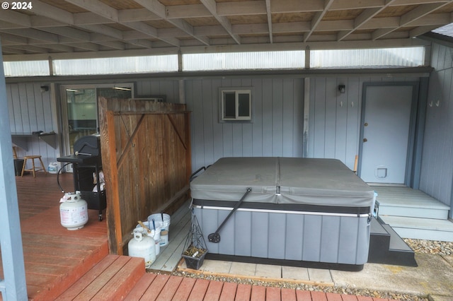 exterior space with a hot tub