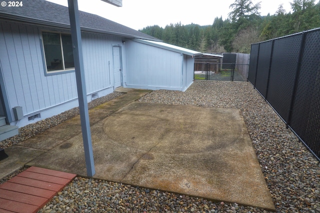 view of yard with a carport and a patio area