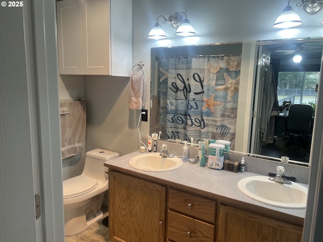 bathroom featuring vanity and toilet