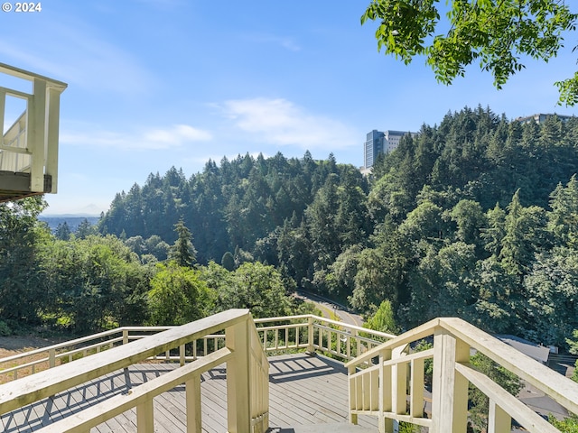 wooden balcony featuring a deck