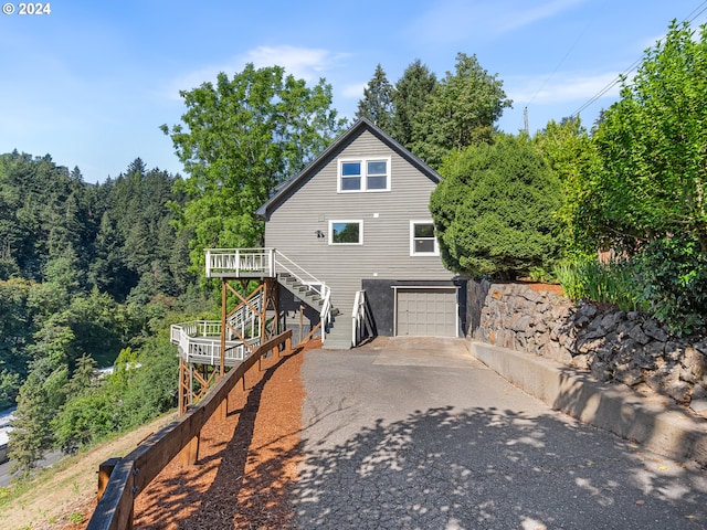 exterior space featuring a deck and a garage