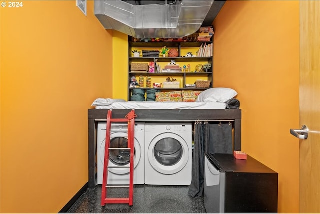 washroom with washing machine and clothes dryer