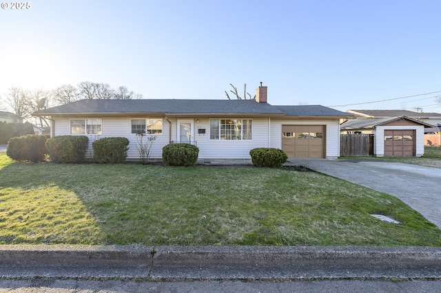 single story home featuring a garage and a front lawn