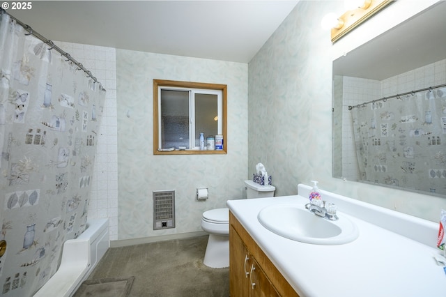 bathroom with vanity, heating unit, toilet, and walk in shower