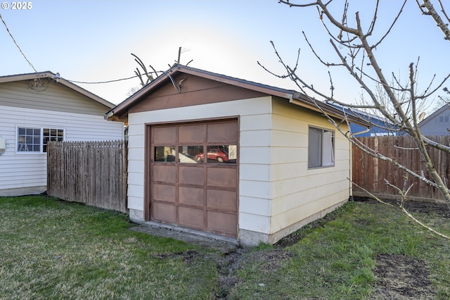 garage featuring a lawn