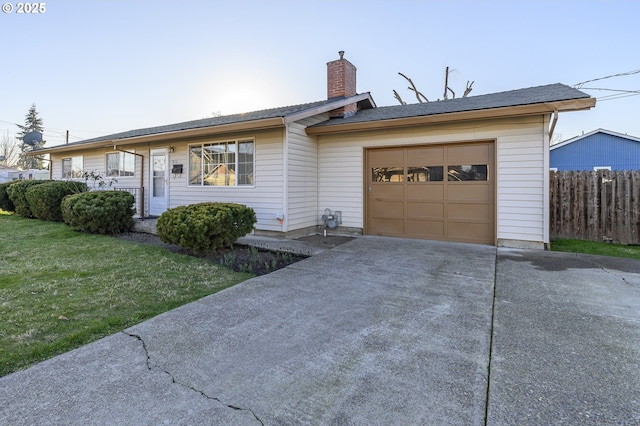 single story home with a garage and a front yard